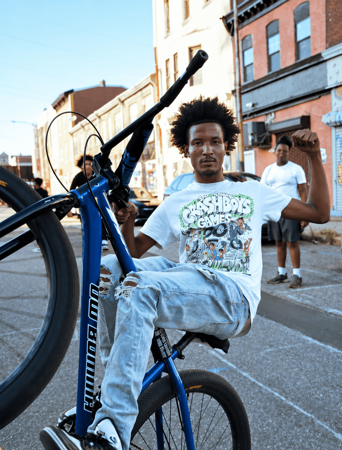 Rider balancing on a blue bicycle