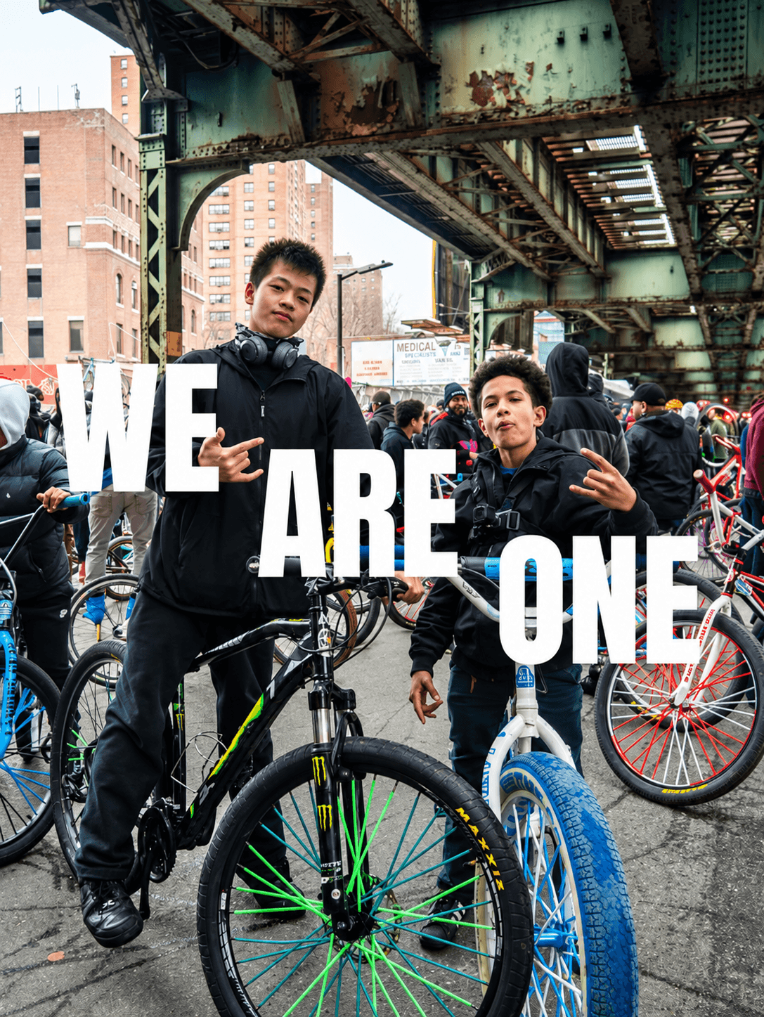 Young riders holding We Are One letters